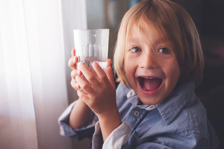 Pinckney Well Drilling & Geothermal | Coastal areas of SC and GA | litlte boy happily showing off his glass of water